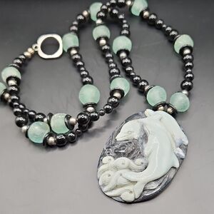 Elegant Black and Green Dolphin Pendant Necklace